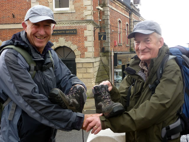 Brian Gould and Roger Lowe carrying Trevor's boots