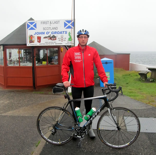 Emlyn Hodges with is bike at John O' Groats.