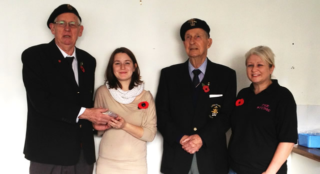 Sam Scammell hands over the fruits of her labour to representatives of the RBL