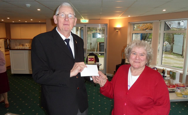 Nell Shepherd presenting £50 raised at the Tuesday Bingo Club