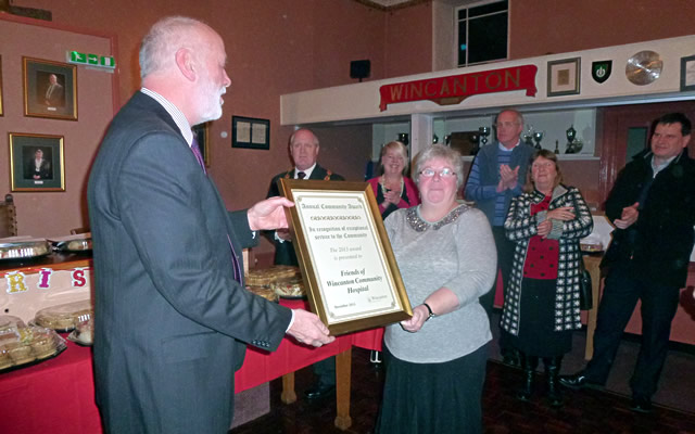 Claire and Mo receive the Service in the Community award