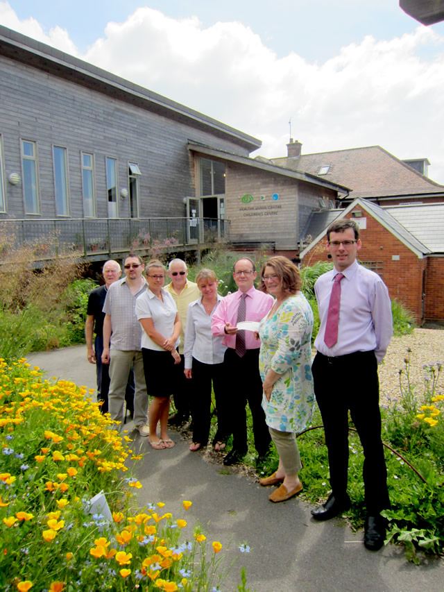 Robert Frith fundraisers present the cheque to the Balsam Centre