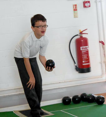 A Wincanton Primary School boy preparing to bowl