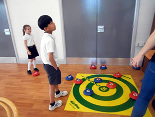 Wincanton Primary School children playing indoor kurling