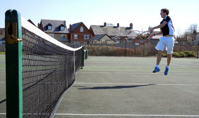 Wincanton Tennis Club's new coach, Dan Cahill, levitating