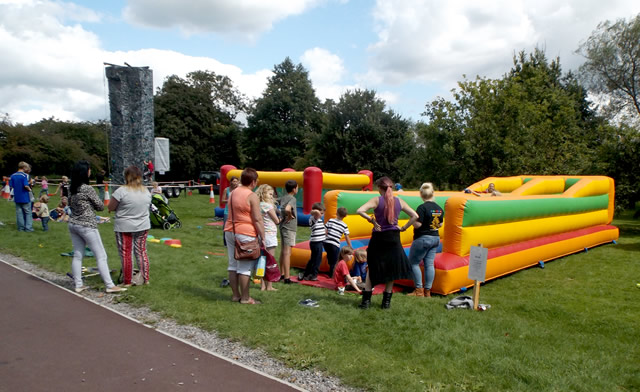 The bouncy castle and climbing wall at the SSDC Play Day in Wincanton