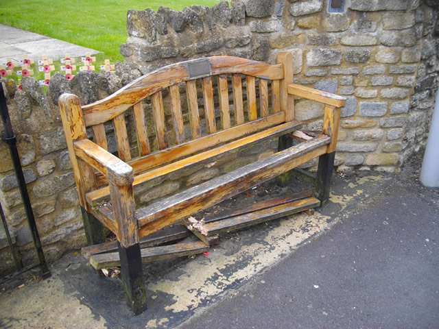 The broken memorial bench outside Wincanton Memorial Hall