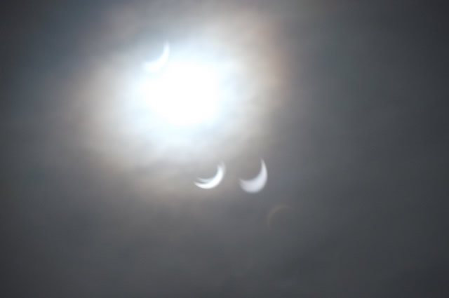 A refracted view of the 2015 solar eclipse through a window, by John Smith