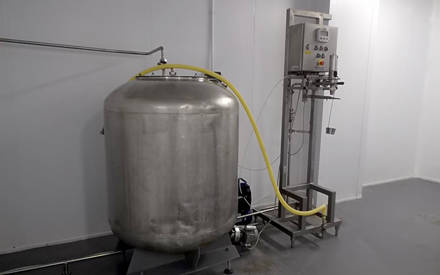 Milk holding tank, and carton filler