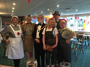 Rowdy Councillors in fancy dress, at the bar