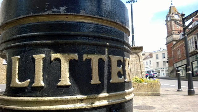 The litter bin at Wincanton's Market Place, with the Town Hall clock tower in the background