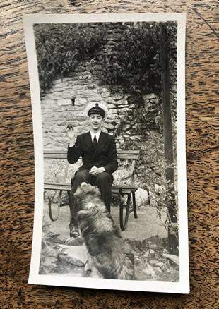 Ted in uniform with family dog