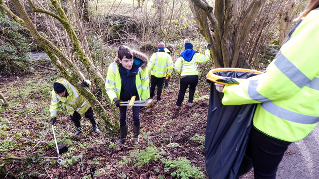 Picking litter from the banks of the River Cale in Wincanton