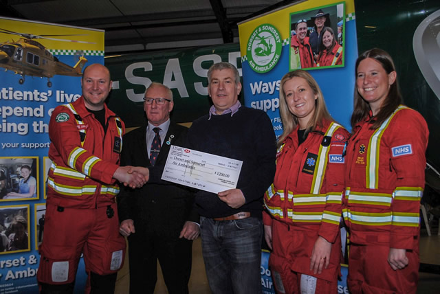 Lee Osborne and Kevin Aldred making a donation of £1200 to Dorset and Somerset Air Ambulance as part of the Lodges Charity for 2018