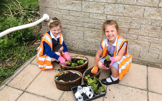 Wincanton Primary School pupils potting plants at Carrington House