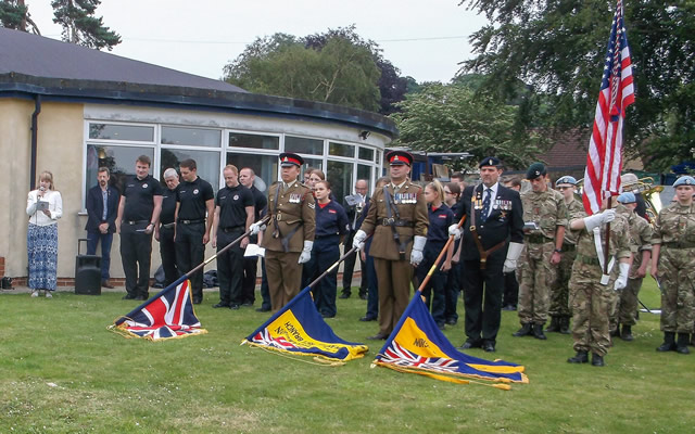 The colour party with flags lowered