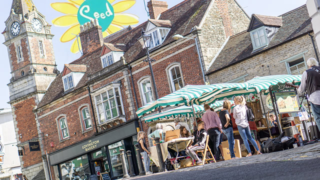 Wincanton SEED Market with the Town Hall clock tower in the background, and the SEED logo