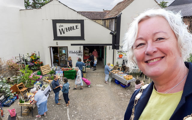 Wincanton's Mayor, Sue Shelbourn-Barrow, in front of Cole's Yard courtyard market, Wincanton High Street, well before lockdown.