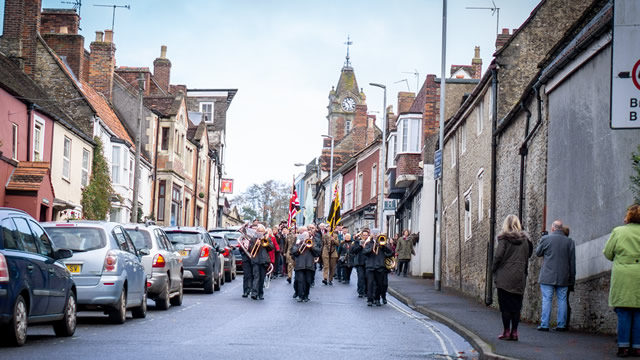 Wincanton's 2019 Remembrance Parade marching down Church Street led by Wincanton Silver Band