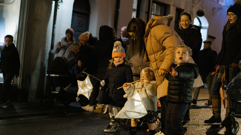 Young children carrying lanterns in Wincanton's 2021 Christmas lantern parade