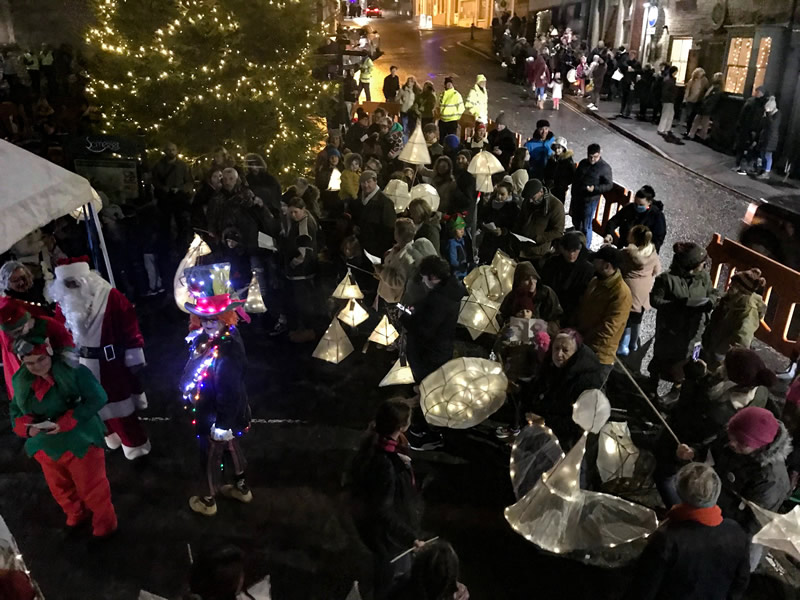 Photo by Ian Thomas of Bootmakers: The crowd singing carols at Wincanton's Market Place after the 2021 Christmas lantern parade