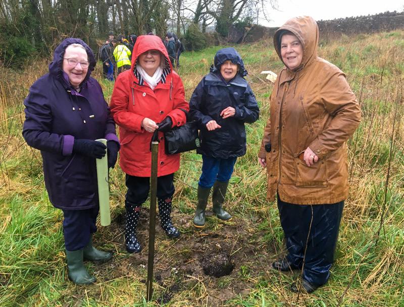 Members of the Women's Institute planting an oak sapling at Wrixon's View